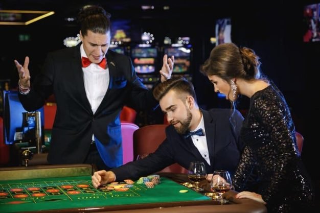 beautiful-rich-people-playing-roulette-casino_144962-8284
