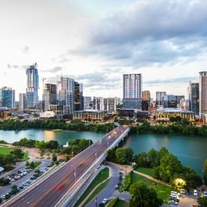 Luxury limo service in Downtown Austin with skyline view at sunset